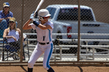 Young Female fastpitch softball player playing club sports.