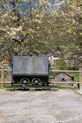 Mine trolley cart wagon on tracks transportation for coal mining in Asturias province of Spain, Tormaleo on a sunny bright day.