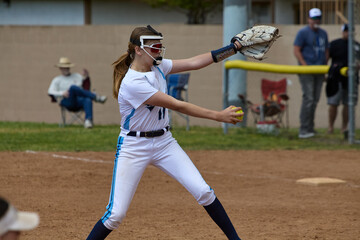 Young Female fastpitch softball player playing club sports.