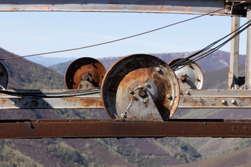 Abandoned industrial metal rusted wheel for cableway  mining.