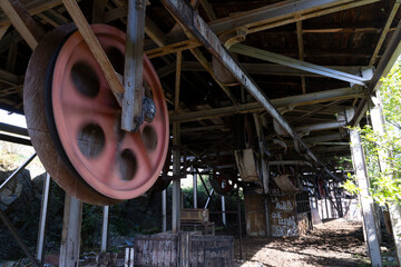 Industrial metal roller wheel rusted metallic equipment part of mining industry
