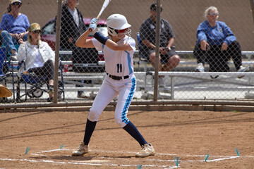 Young Female fastpitch softball player playing club sports.