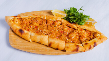 Meat pide on tray	top view