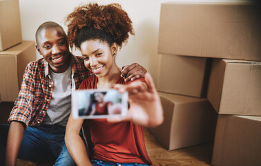 Black couple, selfie and happy on floor with boxes for new house, bonding and break from moving...