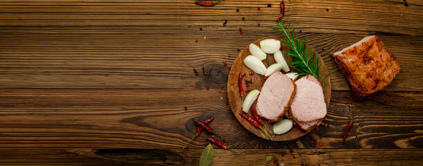 Baked Pork Cut on Wooden Table. Roasted Sliced Loin, Tenderloin Ham Piece, Baked Meat Fillet on Wood