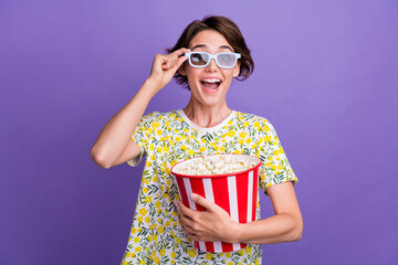 Photo of pretty young woman 3d glasses cinema movie movie pop corn wear t-shirt isolated on violet...