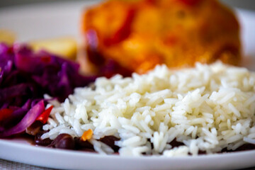 Traditional weekly Brazilian lunch, beans, rice, meat, vegetables and cassava flour