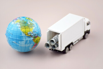 White toy truck with boxes on a light background, space for text.