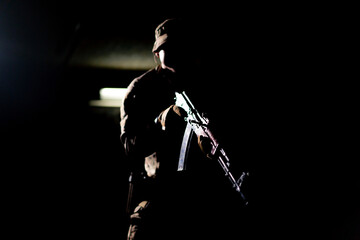 military tactical strategy aiming NATO rifle contrast light back light silhouette