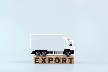 White toy truck on blocks with the text EXPORT.