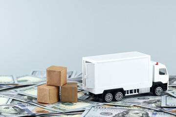 White toy truck with boxes on a light background, space for text.