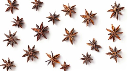 Several star anise pods arranged in a playful, scattered pattern, isolated on a white background to emphasize their unique star shapes