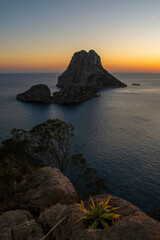 Es Vedrà island sunset view from Cap Jueu cape cliffs, Sant Josep de Sa Talaia, Ibiza, Balearic...