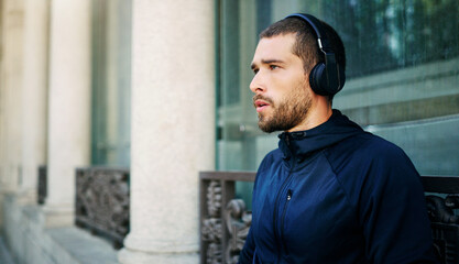 Headphones, man or runner thinking in city ready to start workout, training or outdoor exercise...