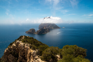 Magical view Es Vedra island covered in misty clouds, Sant Josep de Sa Talaia, Ibiza, Balearic Islands, Spain