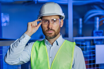Portrait of Smiling Professional Industry Engineer Worker Wearing Safety Uniform, Goggles and Hard Hat