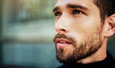 Obraz premium Man, thinking and outdoor for fitness goal with health, sports training and wellness for running exercise. Male runner, thoughtful and face in city with ideas for mindfulness breathing and workout