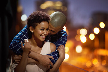 Happy couple, hug and city street at night or travel downtown date for relationship, bokeh or...