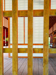 Detail shot of a wooden curtain wall of a pavilion in the Japanese garden of Touluse