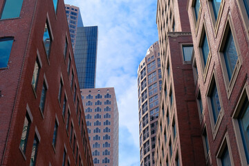 Fototapeta premium Canary wharf street with buildings facade general view in Boston city, american city skyline 