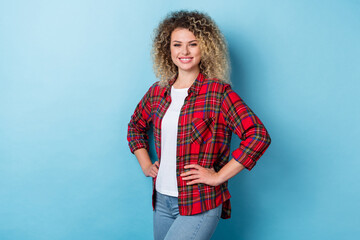 Photo of charming pretty positive confident lady posing hands hips wear checkered shirt isolated...
