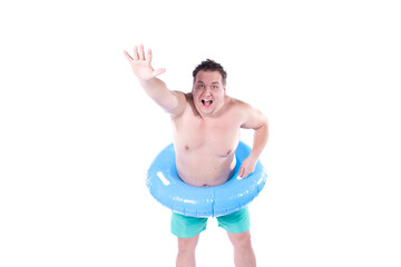 Vacations and holidays. Funny fat man with an inflatable blue circle posing in the studio on a white background. Fun and joy.