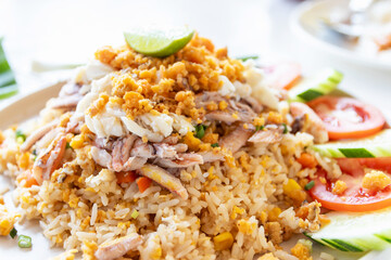 Fried rice with crab on white plate.