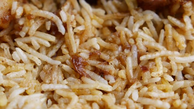  mutton biryani meal in a plate on table.