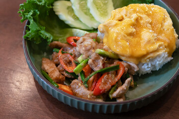 Stir-fried pork with shrimp paste and served with rice and a fried egg.