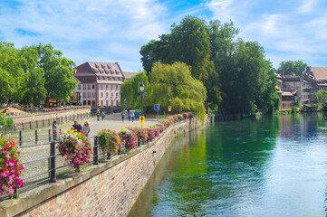 city of peace in summer 
combination of flowers and river, and sidewalk along the river