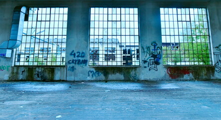 Broken windows inside abandoned factory in Austria.
