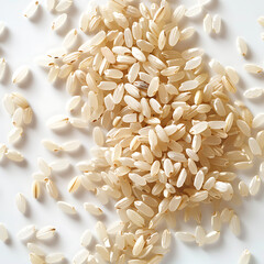 Rice grains scattered on a white background