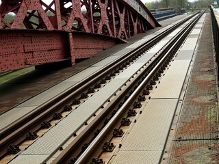Rail tracks, Levensau High Bridge, built 1894, rusty, undergoing replacement. Historic structure,...