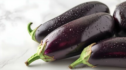 Close up of fresh Eggplants on a white Background
