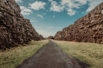 Almannagja fault, long rocky gorge in Iceland. Golden Circle, Þingvellir Park, walk along the canyon between two tectonic plates.