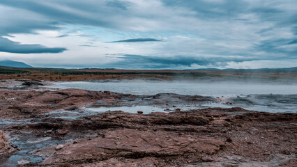 Geysir area. Steam vents, fumaroles and boiling mud pots. Panorama of suggestive volcanic landscape...