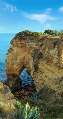 Summer Atlantic ocean coast view with rock formations (Porches, Lagoa, Algarve, Portugal).