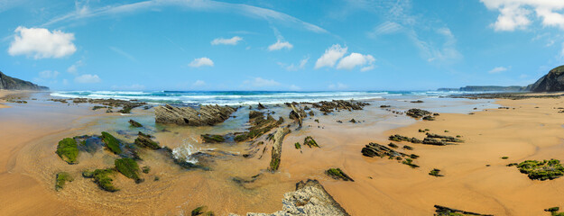 Rock formations on sandy beach (Algarve, Costa Vicentina, Portugal). 