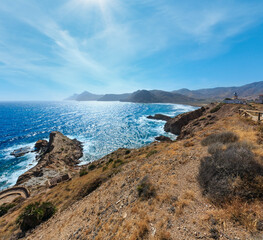 Mediterranean sea summer rocky coast view and lighthouse El hoyo del faro (Portman, Costa Blanca, Spain).