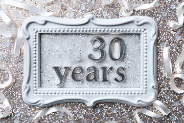 Congratulatory frame with the inscription in silver letters 30 years