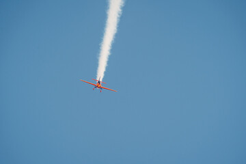 Stunt Plane Performance at Air Show with Smoke Trail