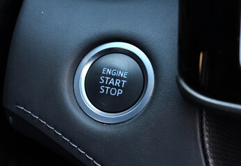 Close-up of a start-stop button on a dashboard in a modern premium luxury car. Engine Start Stop...