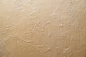 Golden abstract texture on canvas, background