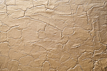 Golden abstract texture on canvas, background