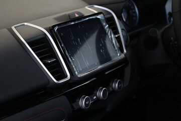 Selective focus Interior of a modern car, Car Air Conditioner with screen display on console.