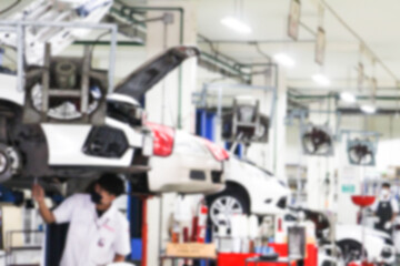 Blurry Line of body Car with the equipment repair station in the garage shop. fix maintenance or checking by mechanic workshop. Business about of car or vehicle concept.