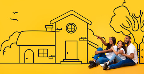 A happy African American family sits closely together against a vibrant yellow backdrop that features a whimsical drawing of a house
