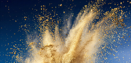 Navy blue sky backdrop with a luminous explosion of shimmering gold chalk dust.