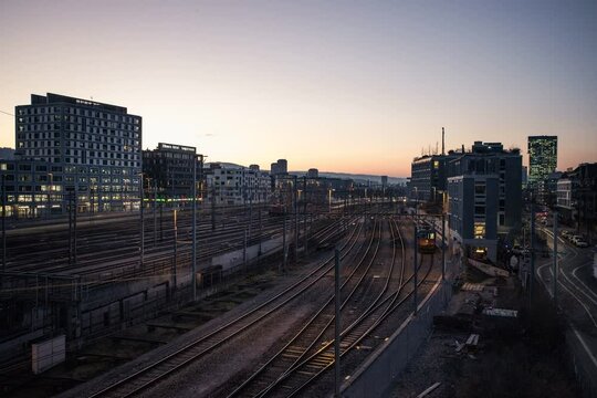 city timelapse at sunset view over train tracks