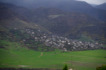 Akner village and surrounding at foggy day from distance, Armenia 